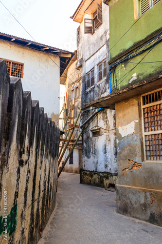 Typical narrow street in Stone Town, Zanzibar, Tanzania © olyasolodenko