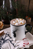 Cocoa with marshmallows and citrus zest on christmas background
