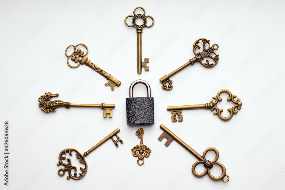 Antique keys are located around the padlock Antique keys are located around the padlock