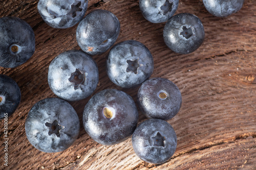 Fresh blueberries on wooden background.