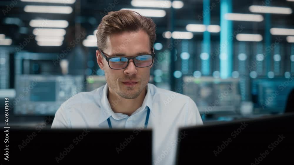 High-Tech Data Center Server Control: IT Specialist Administrator Working on Computer, Screen Showing Advancing Big Data AI Analysis. Web Services, Cloud Computing, Analytics Facility, Cyber Security High-Tech Data Center Server Control: IT Specialist Administrator Working on Computer, Screen Showing Advancing Big Data AI Analysis. Web Services, Cloud Computing, Analytics Facility, Cyber Security