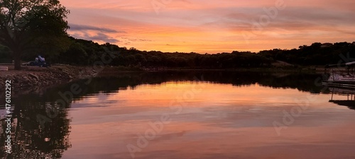Sunset reflecting off lake © Austin