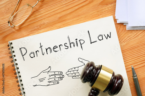 Partnership law is shown on the business photo using the text