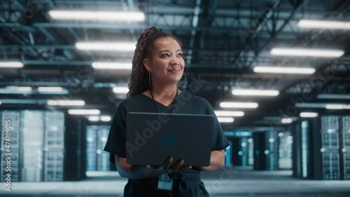 Wallpaper Mural Concept Dolly Zoom Out: Portrait of Black Female Specialist Using Laptop in Big Data Center. Cinematic Shot with High-Tech Special Effect for Technology Science Breakethrough, Progress, Innovation Torontodigital.ca