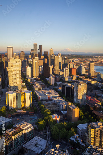 Seattle, Washington, USA - June 4 2021: Seattle downtown skyline and Mount Rainier during summer sunset. View from Seattle needle.