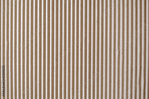 Texture of corrugated cardboard sheet in brown colour.