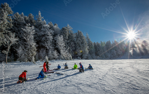 Ski team resting on the slopes 