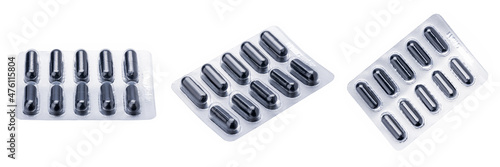 pill blister pack isolated on a white background. drug package cut out. black tablets stack photo