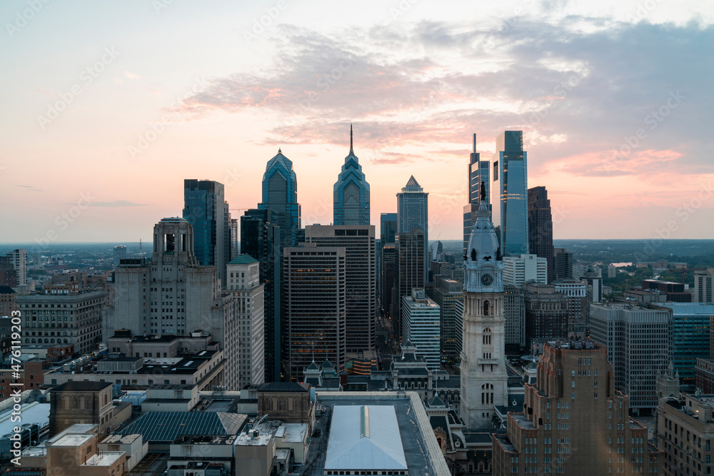 Aerial panoramic cityscape of Philadelphia financial downtown, Pennsylvania, USA. Philadelphia City Hall Clock Tower at summer sunset. A vibrant business and cultural neighborhoods.