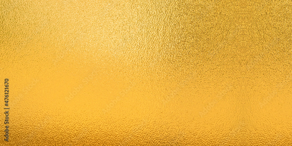 Gold wall texture background. Yellow shiny gold paint on wall surface with light reflection, Gold wall texture background. Yellow shiny gold paint on wall surface with light reflection,
