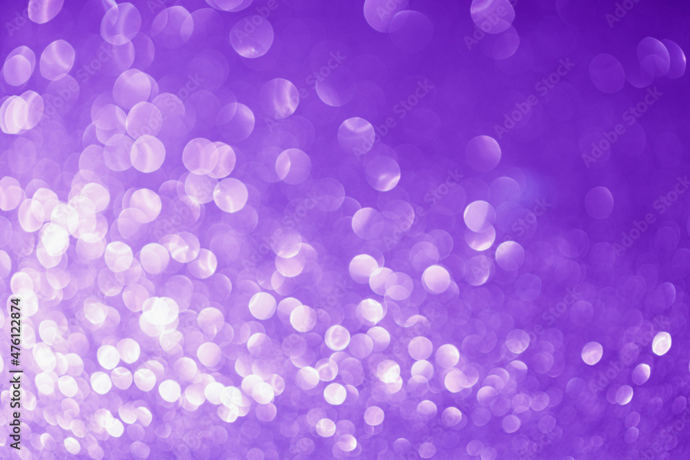Festive abstract blurred glitter background purple color. Bokeh effect. Holiday decoration concept. Festive abstract blurred glitter background purple color. Bokeh effect. Holiday decoration concept.