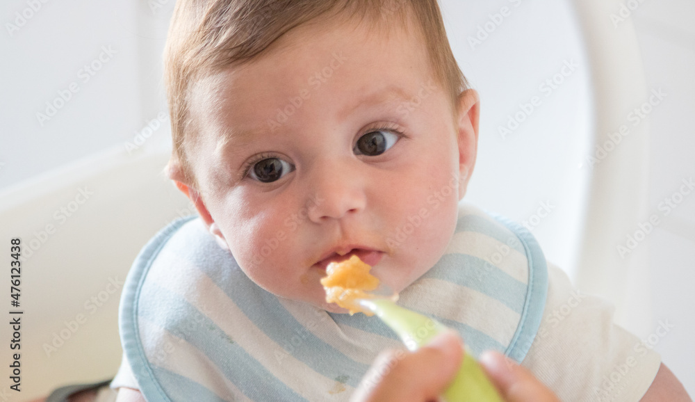 Happy baby with his mother during breakfast Happy baby with his mother during breakfast