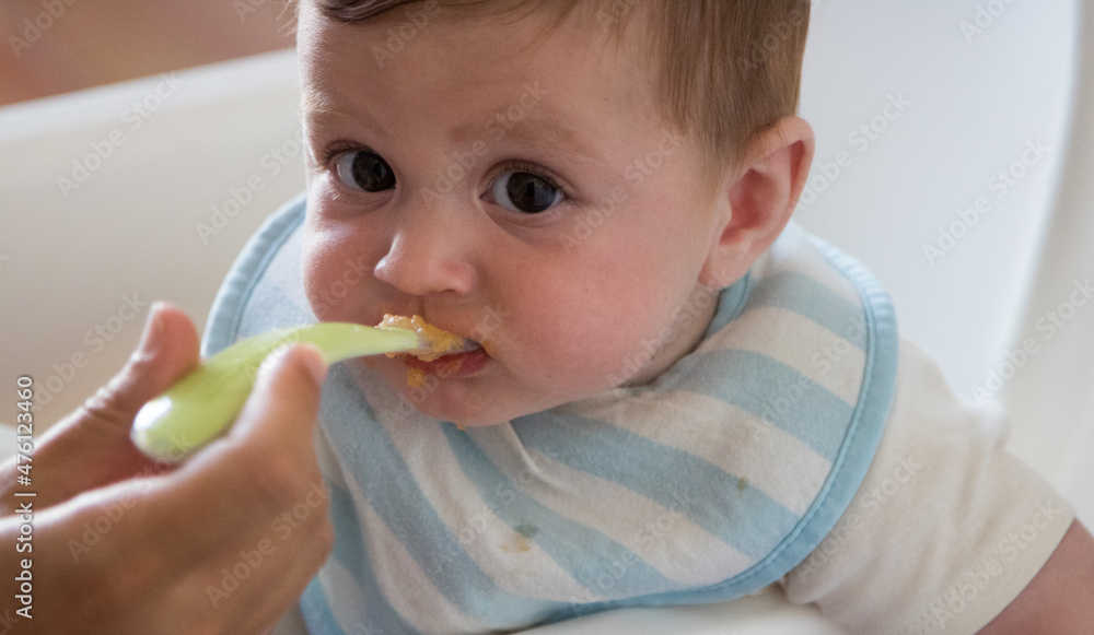 Happy baby with his mother during breakfast Happy baby with his mother during breakfast
