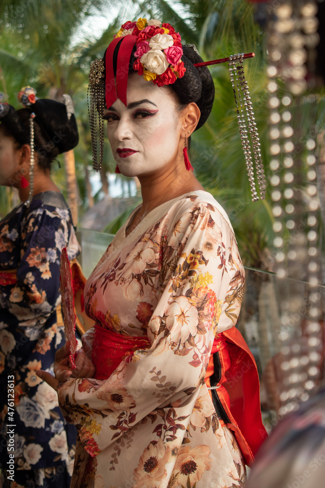 adult latin woman wearing geisha costume
