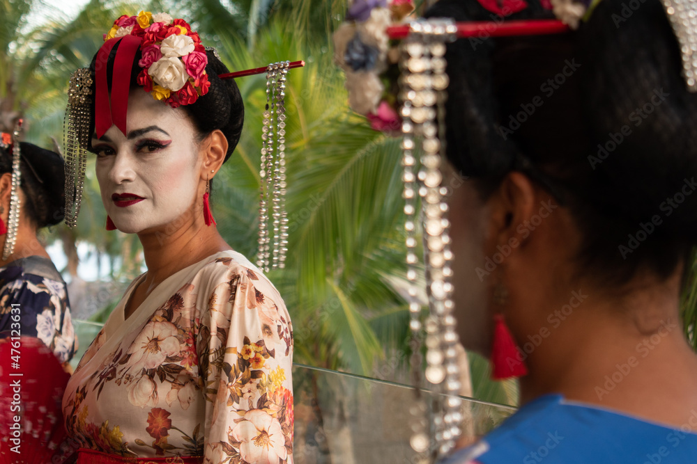 Close up of latin woman wearing geisha costume 