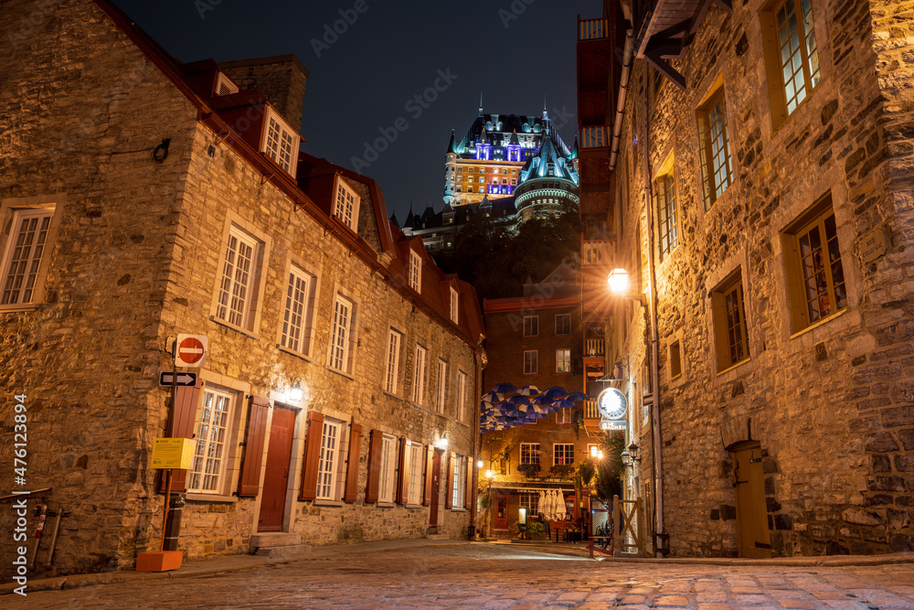 Quebec, Canada - October 18 2021 : Umbrella Alley. Quebec City Old Town street view in autumn night.