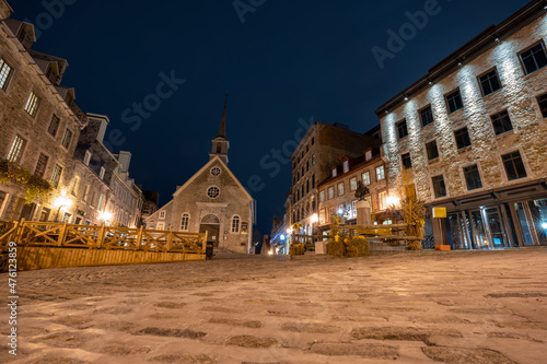 Quebec, Canada - October 18 2021 : Night view of the Quebec City Old Town street view in autumn. Place Royale. Rue Notre-Dame. photo