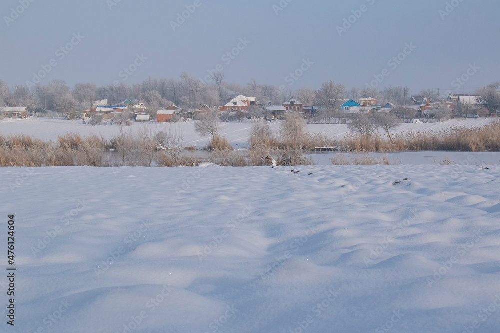winter village across the river