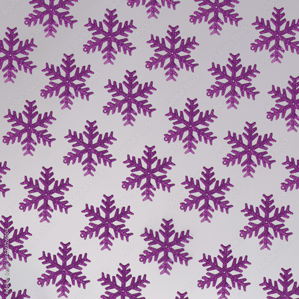 Winter holidays pattern design.purple snowflake on a soft background.aesthetic design Winter holidays pattern design.purple snowflake on a soft background.aesthetic design