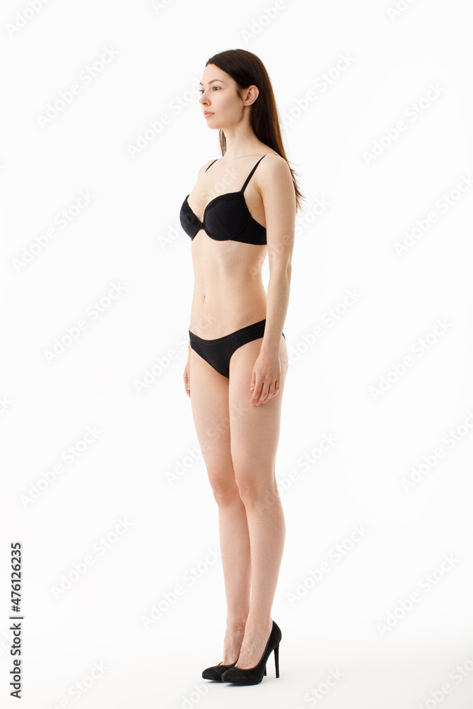 Model tests. Snap Models back view, Beautiful brunette woman in underwear, isolated on white.