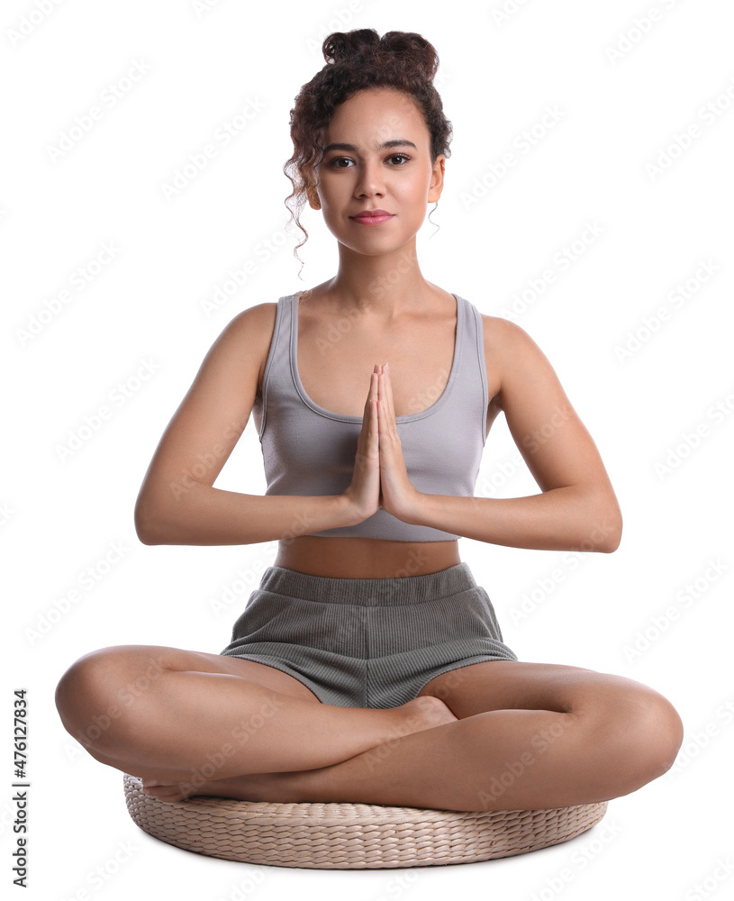 Beautiful African-American woman meditating on white background Beautiful African-American woman meditating on white background