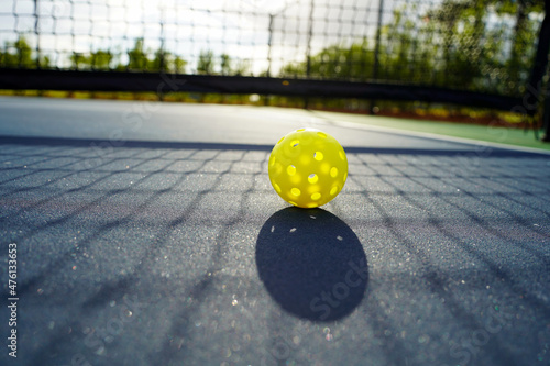Close up of a pickleball on pickleball court. photo