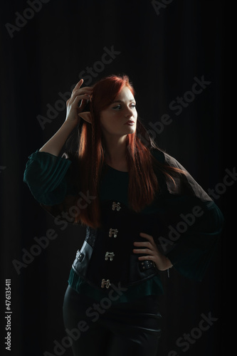 Photography Beautiful redhead elf girl on black background
