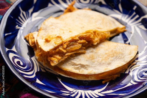 Chicken tinga quesadilla with flour tortilla. Mexican food