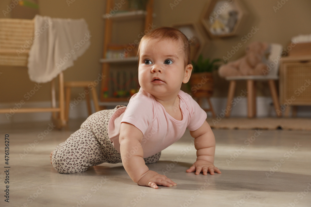 Cute baby crawling on floor at home Cute baby crawling on floor at home