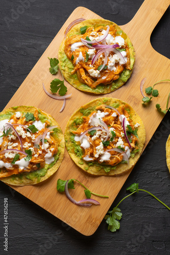 Chicken tinga tostadas with cheese and avocado. Mexican food