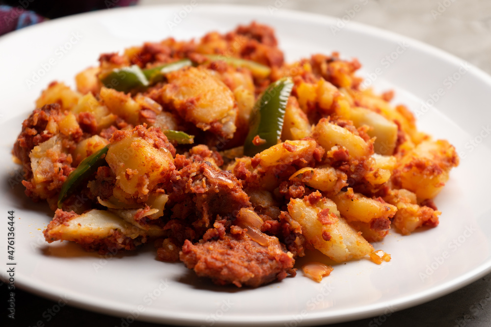 Potatoes with chorizo on a gray background. Mexican food Potatoes with chorizo on a gray background. Mexican food