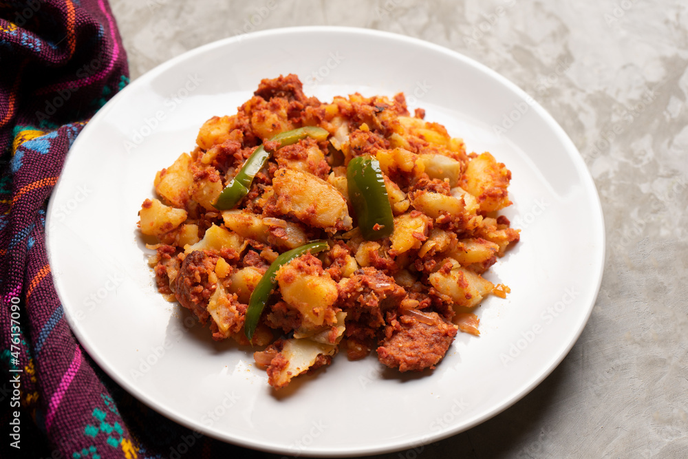 Potatoes with chorizo on a gray background. Mexican food Potatoes with chorizo on a gray background. Mexican food