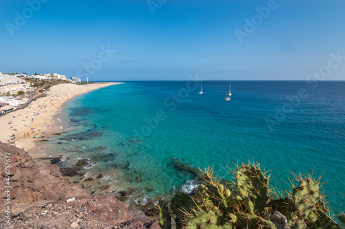 View of the beautiful and colorful Morro Jable Beach (Playa Morro Jable) from a viewpoint close by - Fuerteventura, Canary Islands, Spain