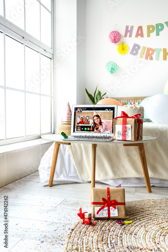 Laptop and gifts in interio...