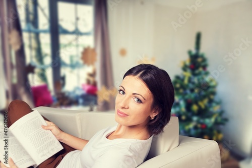 Positive girl sit with x-mas Christmas rest relax concept in house indoors