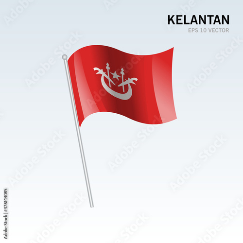 Waving flag of Kelantan state and federal territory of Malaysia isolated on gray background