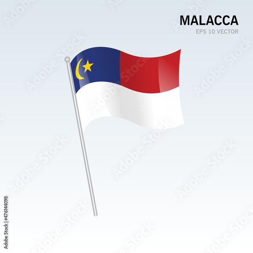 Waving flag of Malacca state and federal territory of Malaysia isolated on gray background