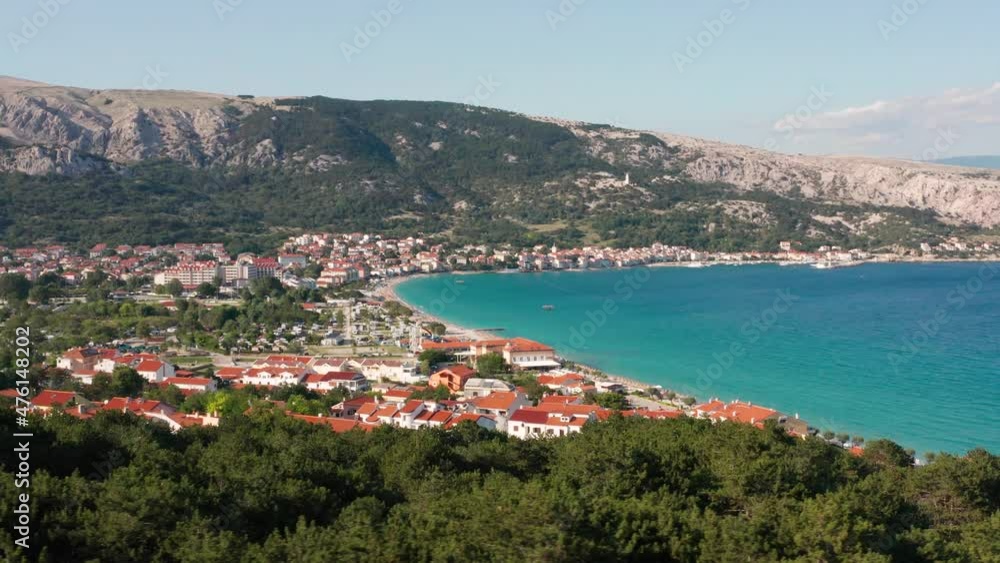 Seaside Town At Krk Island With Calm Blue Sea On A Sunny Day In Croatia. - aerial reveal Seaside Town At Krk Island With Calm Blue Sea On A Sunny Day In Croatia. - aerial reveal