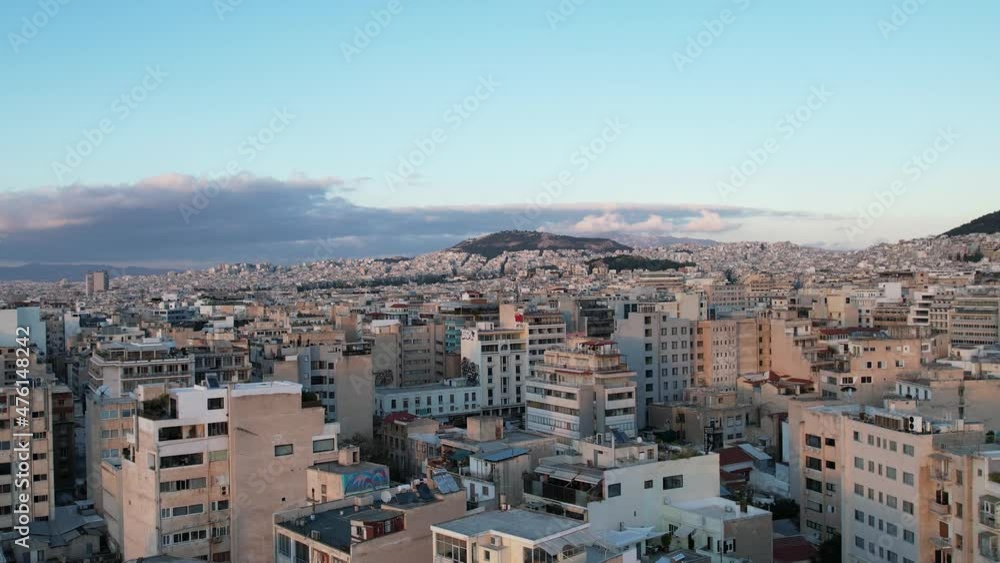 Aerial view away from the Acropolis rock and Monastiraki square in sunny Athens, Greece - circling, drone shot Aerial view away from the Acropolis rock and Monastiraki square in sunny Athens, Greece - circling, drone shot