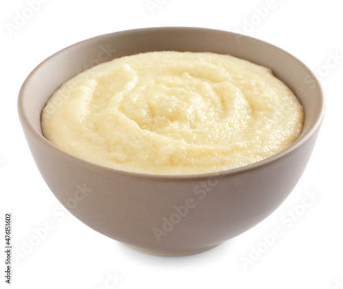 Bowl with delicious semolina pudding on white background