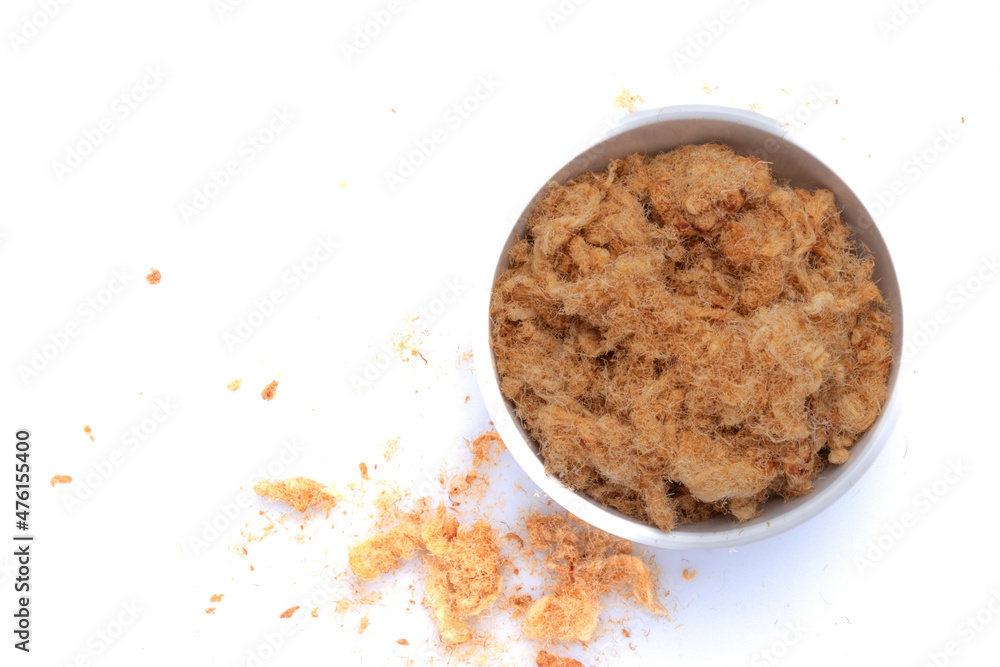 dried shredded pork in a white ceramic cup dried shredded pork in a white ceramic cup