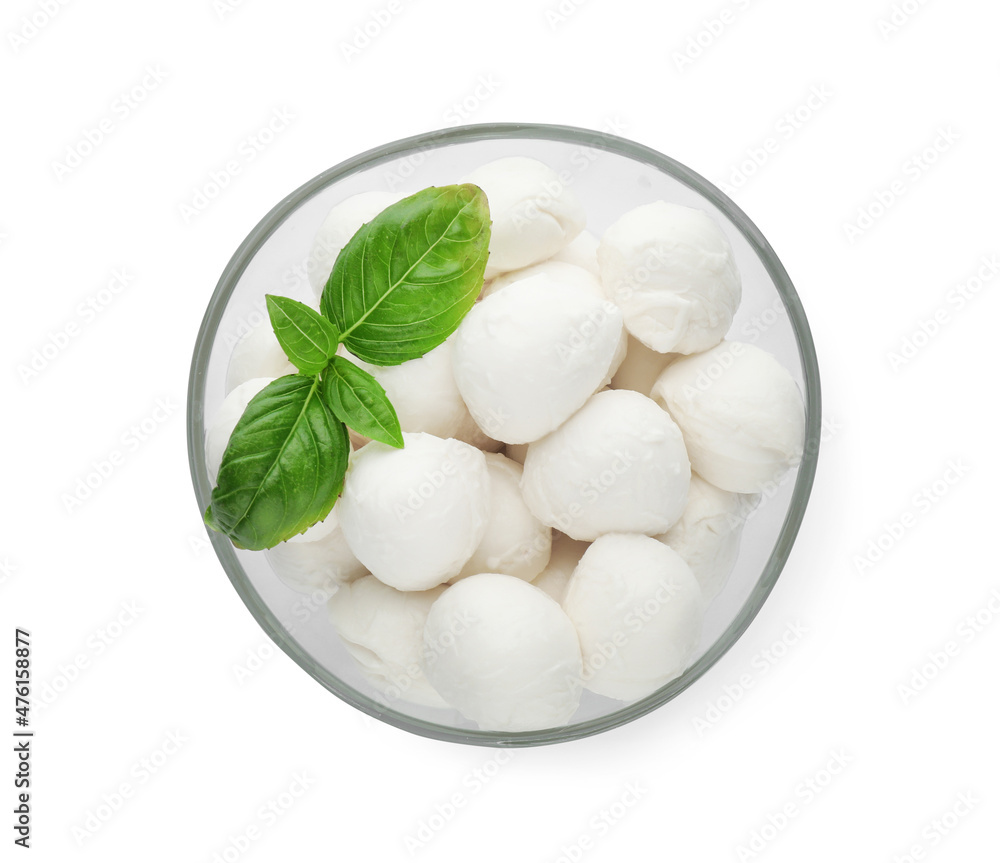 Bowl with mozzarella cheese balls and basil on white background, top view Bowl with mozzarella cheese balls and basil on white background, top view