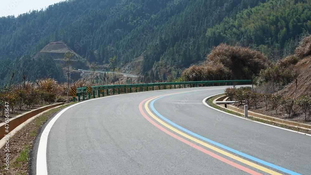 The beautiful country road cross the mountains and village in the countryside of the China The beautiful country road cross the mountains and village in the countryside of the China
