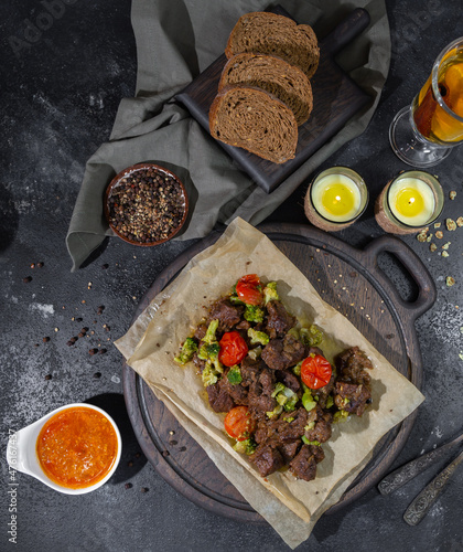 roasted beef slices, bread, sauces and tea with lemon and cinnamon