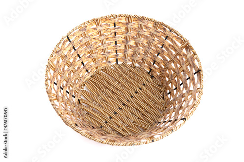 wicker basket for fruits or buns on a white background, top view