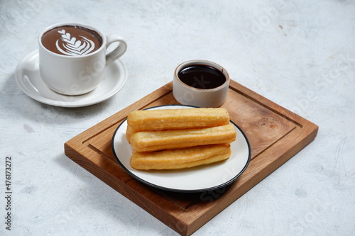 Churros,spanish traditional dessert and chocolate dipping photo