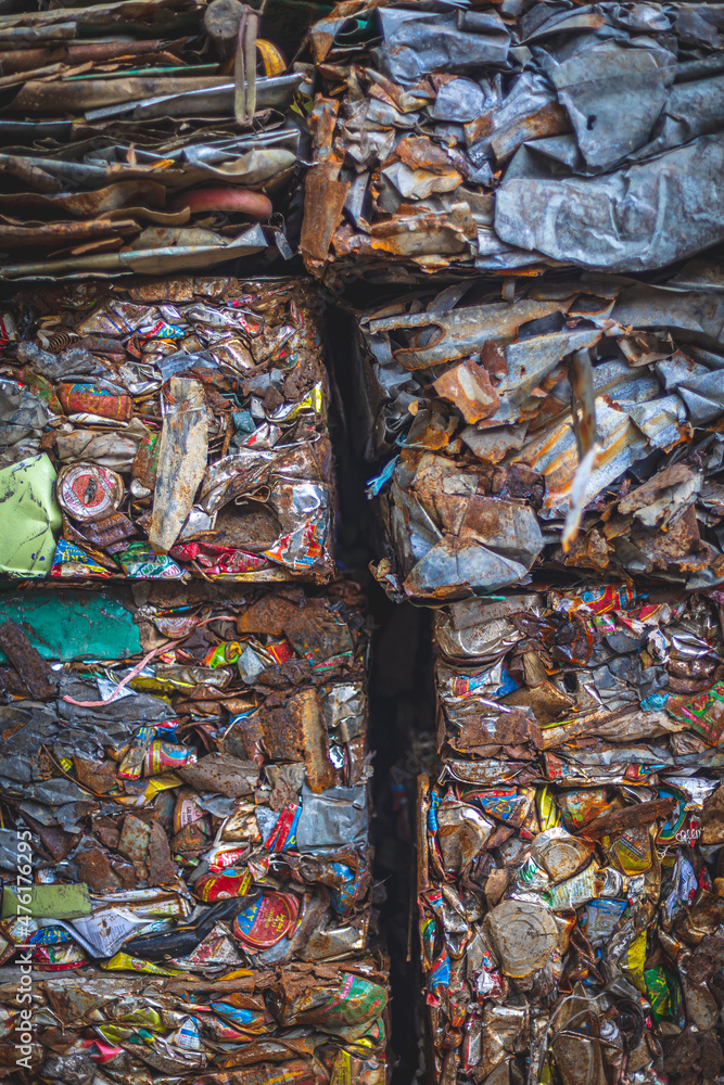 Compacted Metal trash waiting for transport in a waste recycling center in Teknaf, Bangladesh Compacted Metal trash waiting for transport in a waste recycling center in Teknaf, Bangladesh