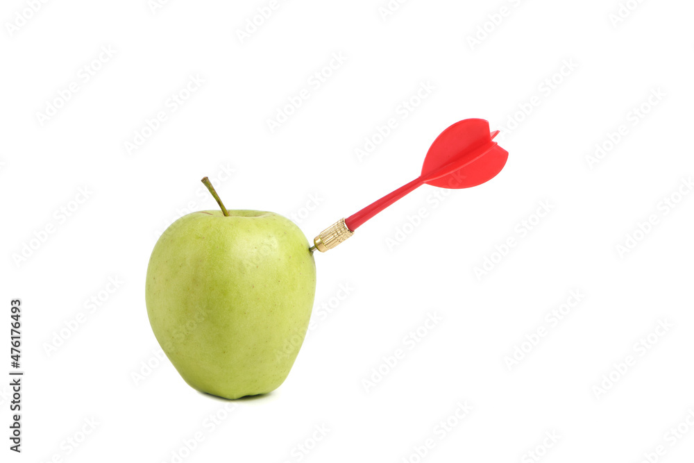 Obraz premium Red dart for playing darts hits straight into apple.Concept of competition and achievement goals.Achieving goals in business and life.