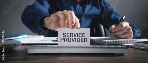 Man showing Service Provider text in business card.