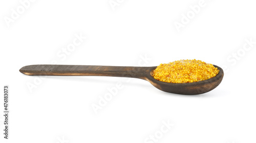 French whole grain mustard in wooden spoon isolated on white